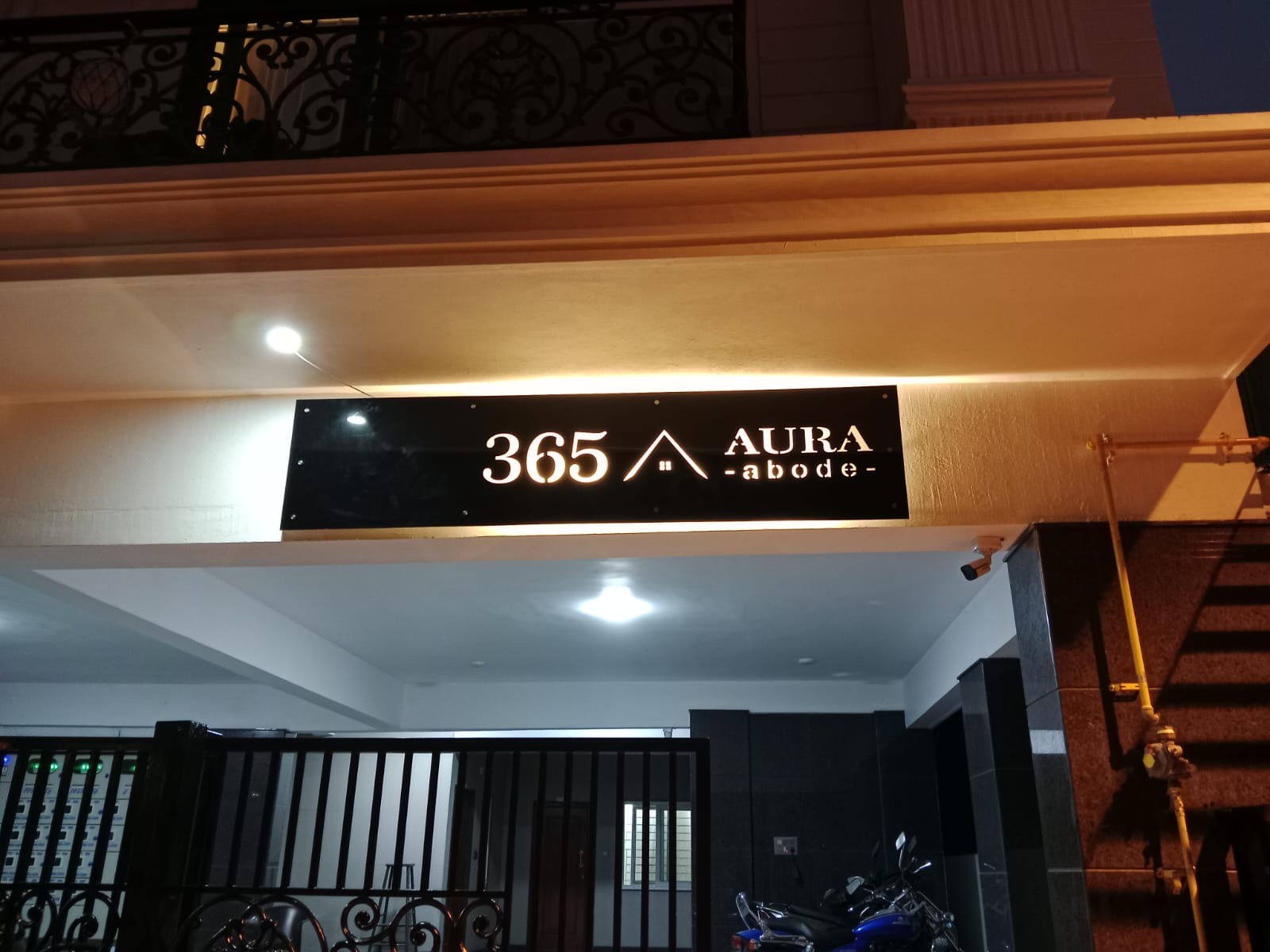 Aura Abode entrance signage