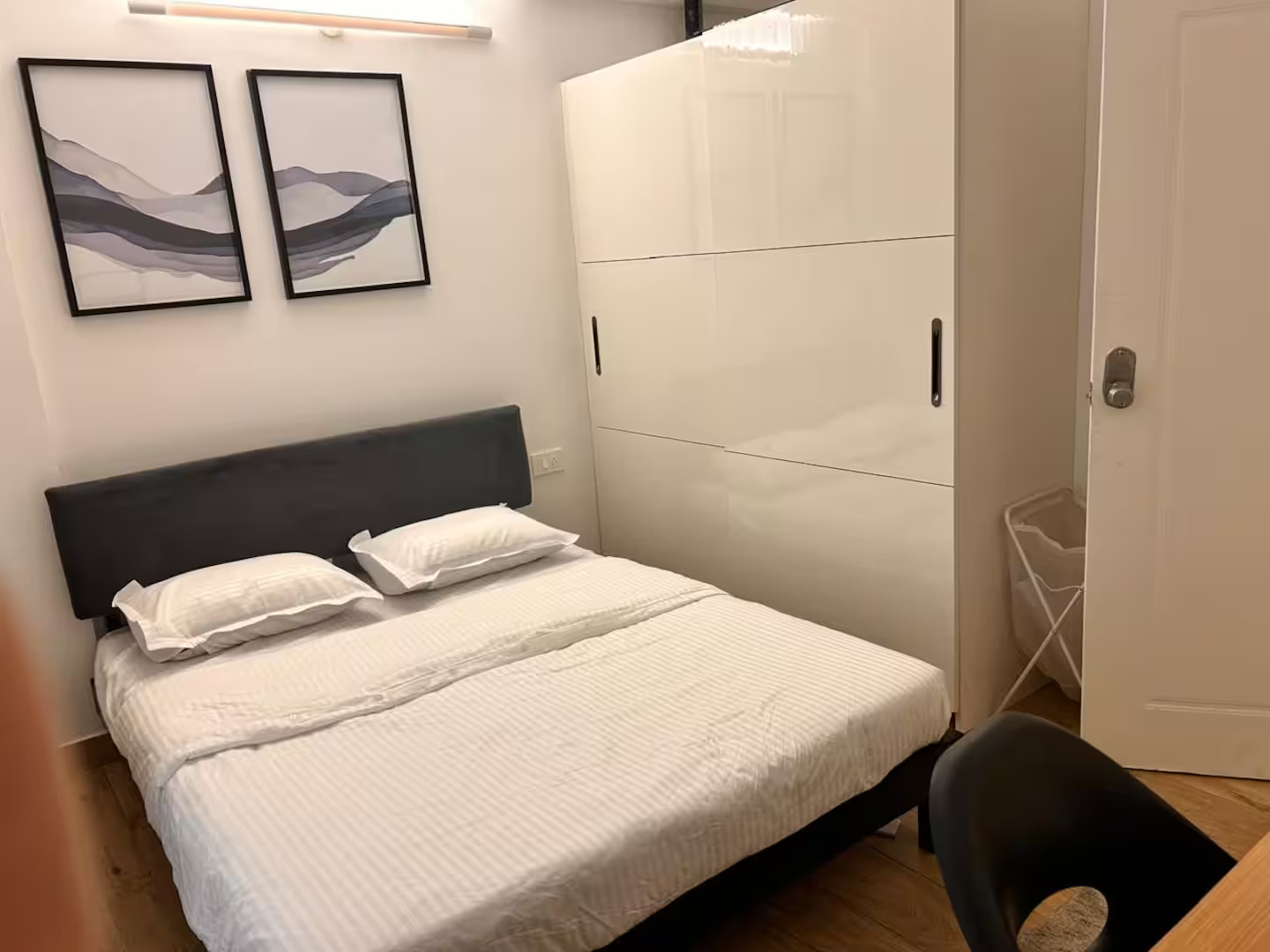 Furnished bedroom with wardrobe